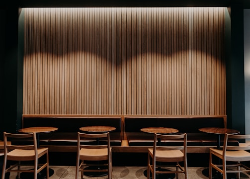 Cozy corner of offpark with warm lighting and inviting seating for gatherings.