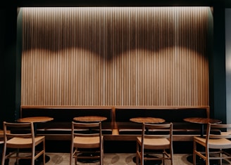 brown wooden chairs and tables