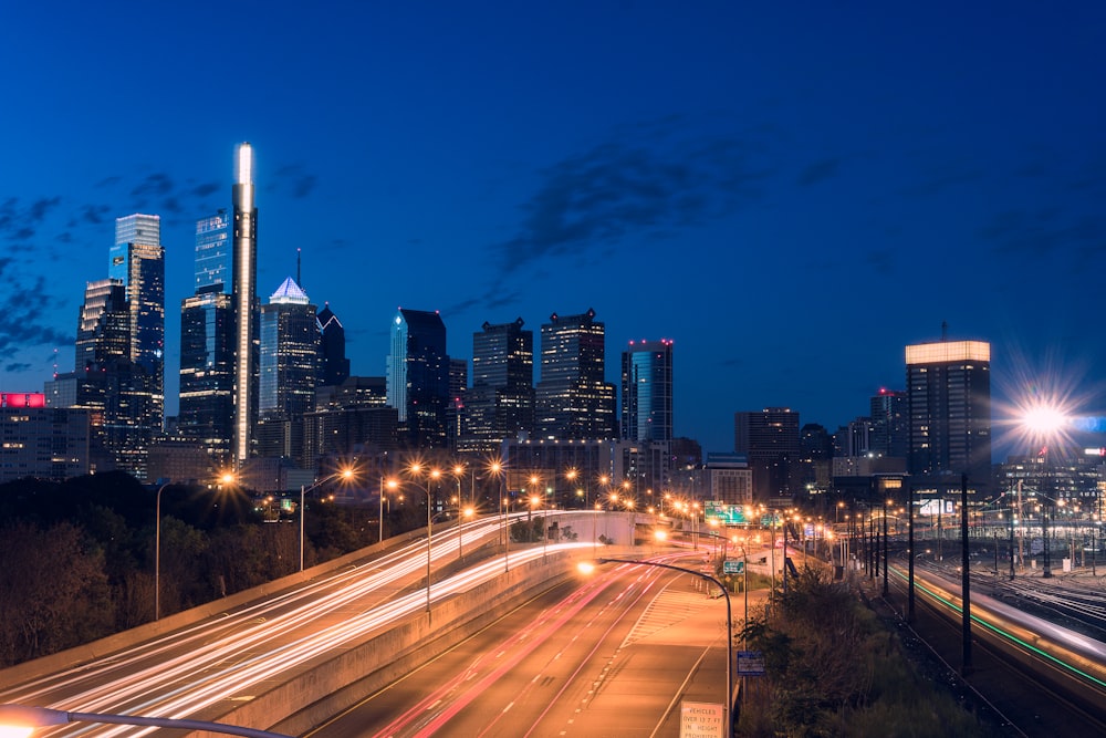 timelapse photography of street and high-rise buildings