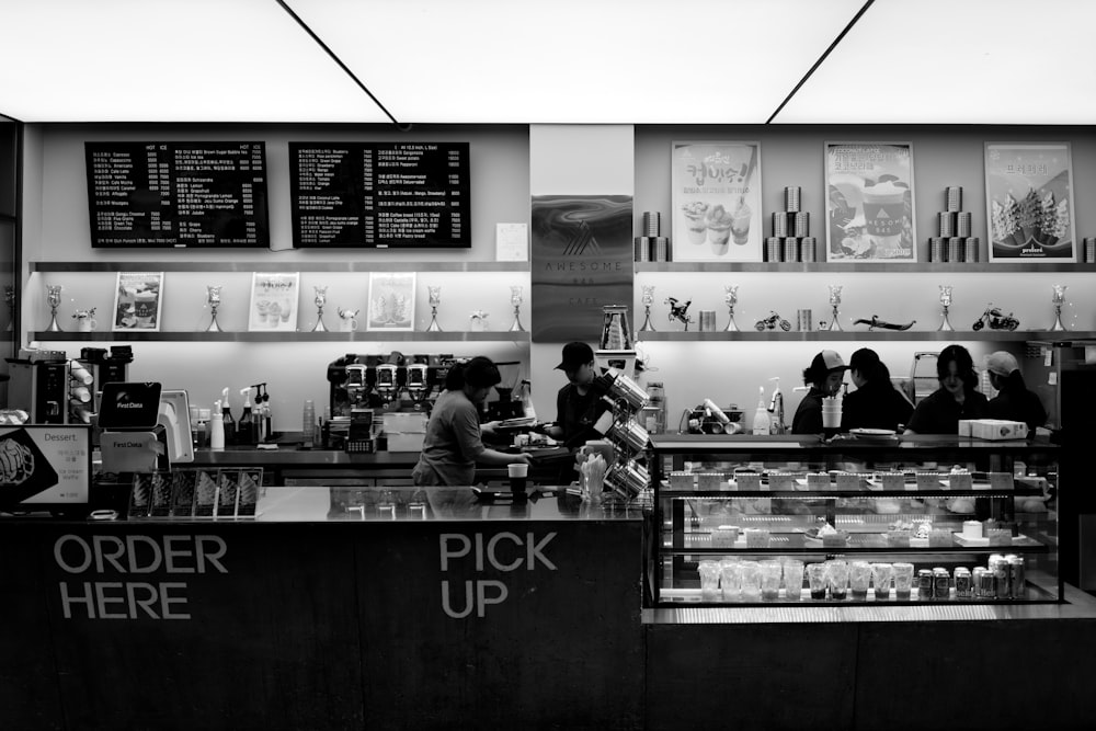 a black and white photo of a coffee shop