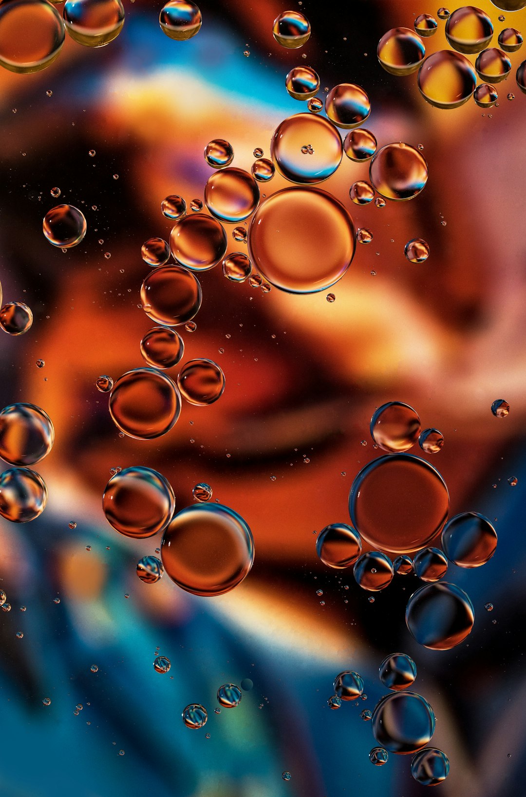 "Copper Glow". Oil drops on water. The background is an A3 photocopy of one of Unsplash photographer Vinicius Amano's fantastic photos. Please see the tutorial on the page "Oil and water photography" on my site Tracts4free.WordPress.com.