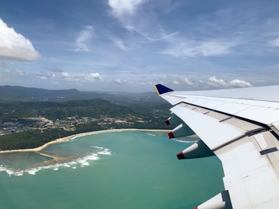 A scenic aerial view of a popular Mexican beach destination from a plane window.