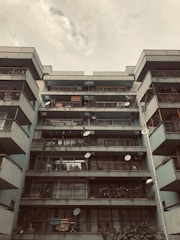 Urban apartment building with balconies and city view.