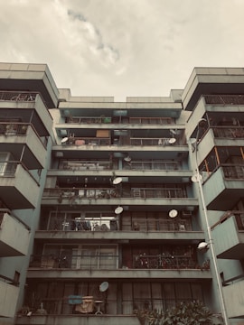 Urban apartment building with balconies and city view.