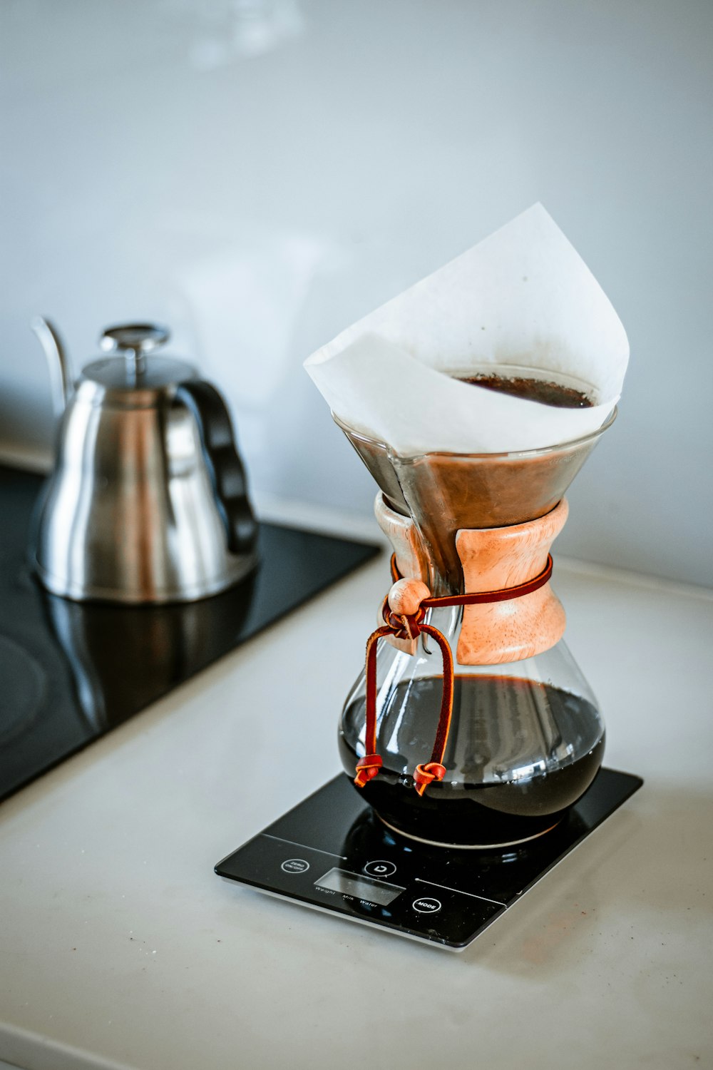 brown clear-glass coffee pitcher