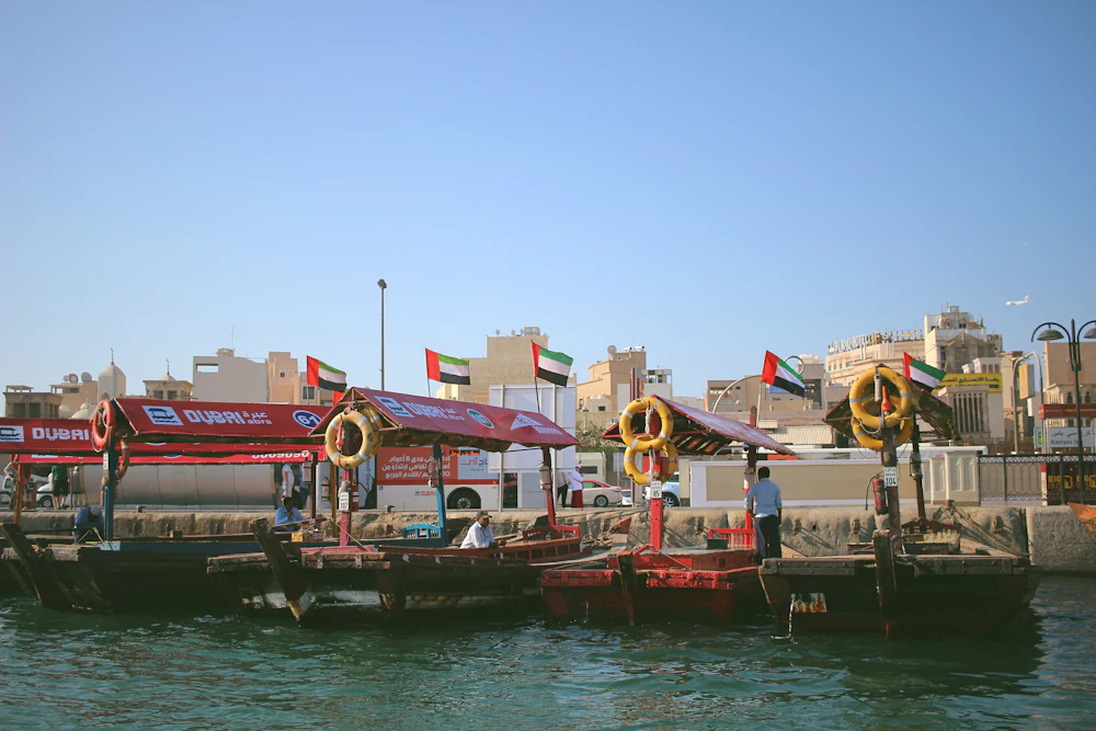 Abra boats waiting at a station on Dubai Creek