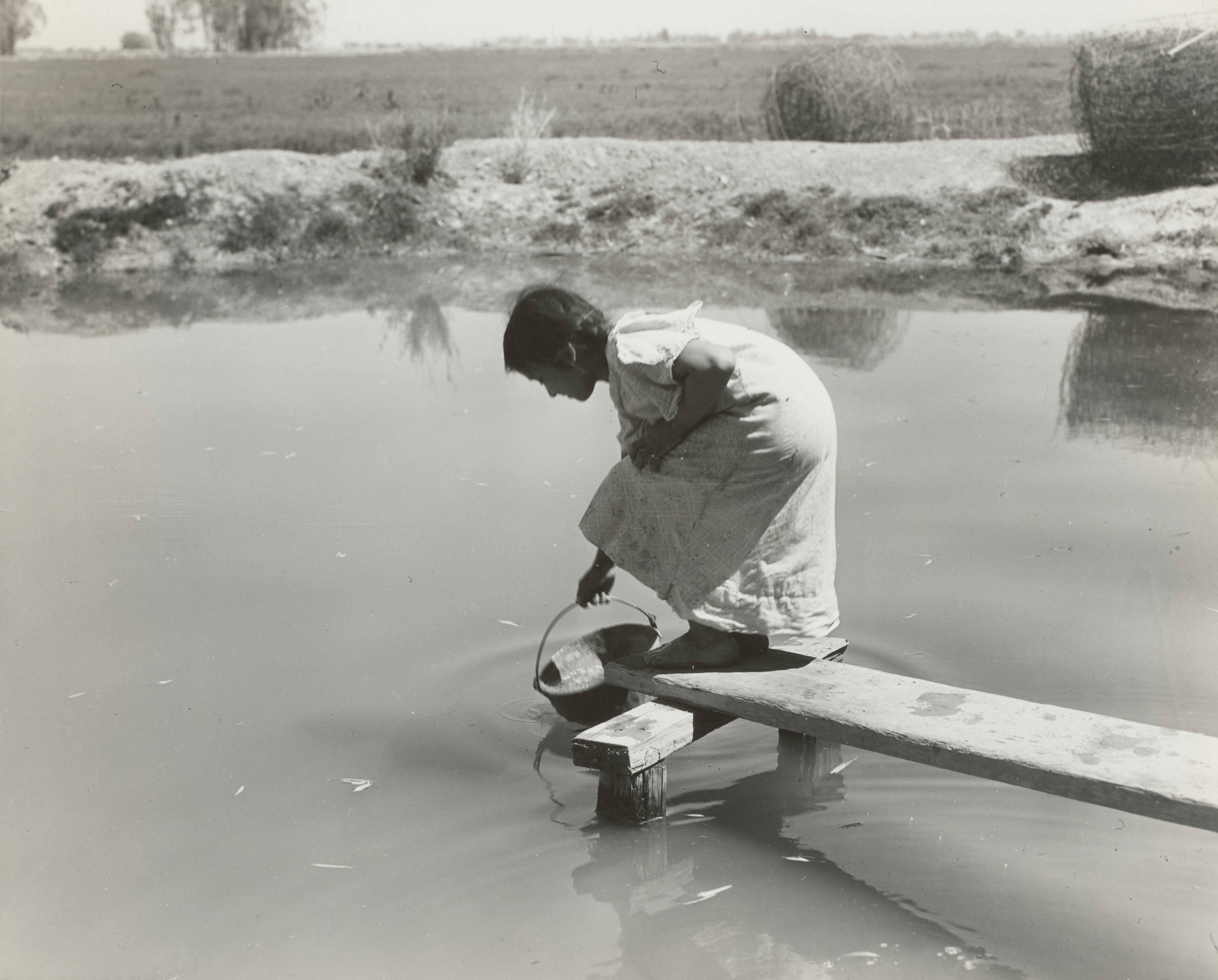 Reservoir technician working in the field