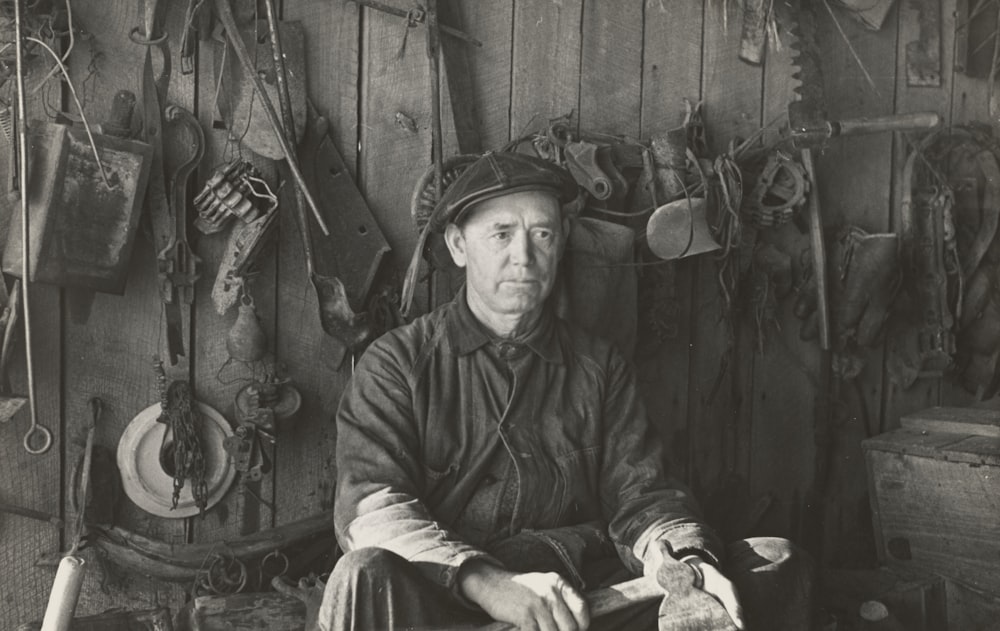 man sitting near tools