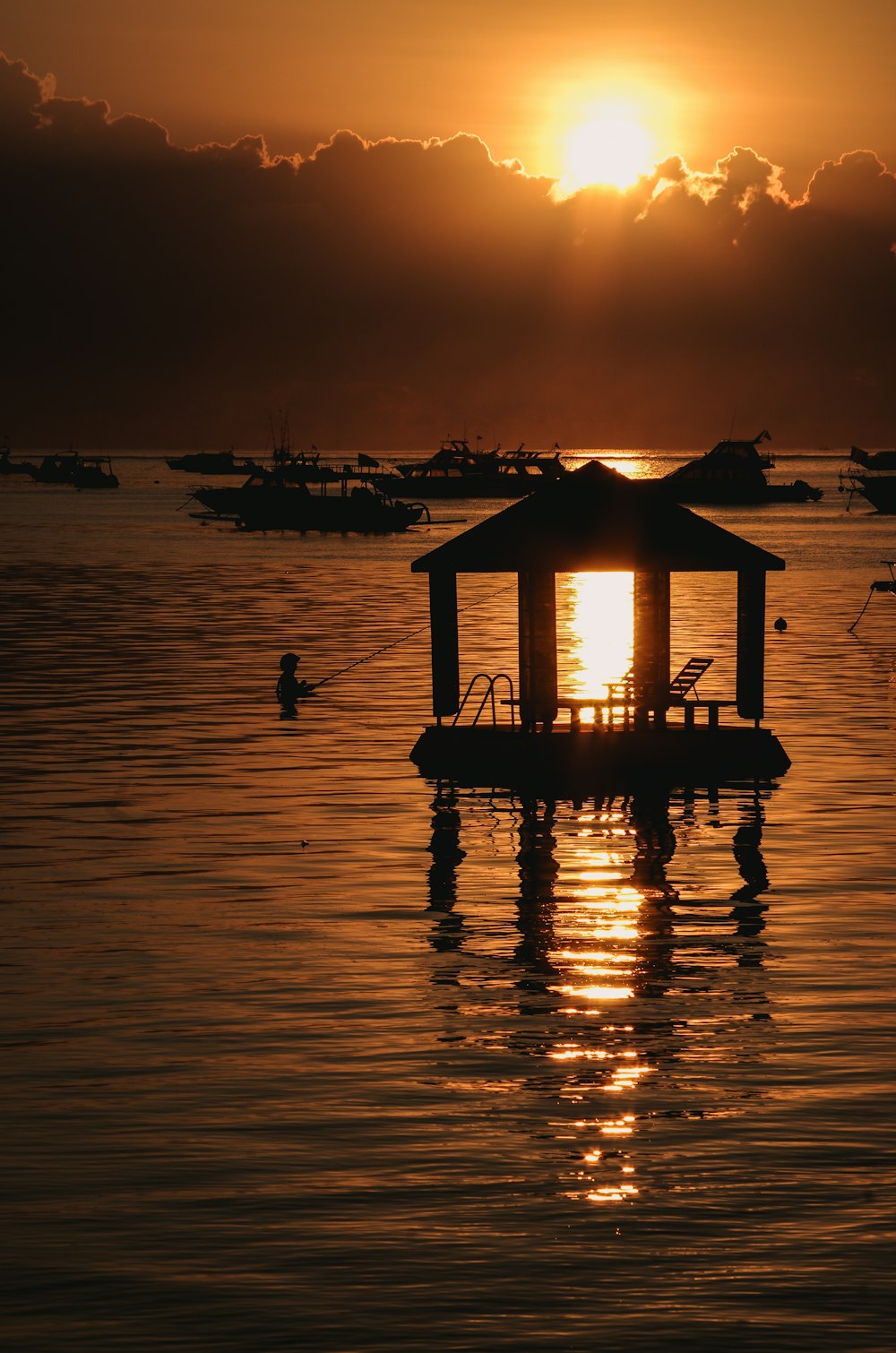 silhouette beach houses during sunset