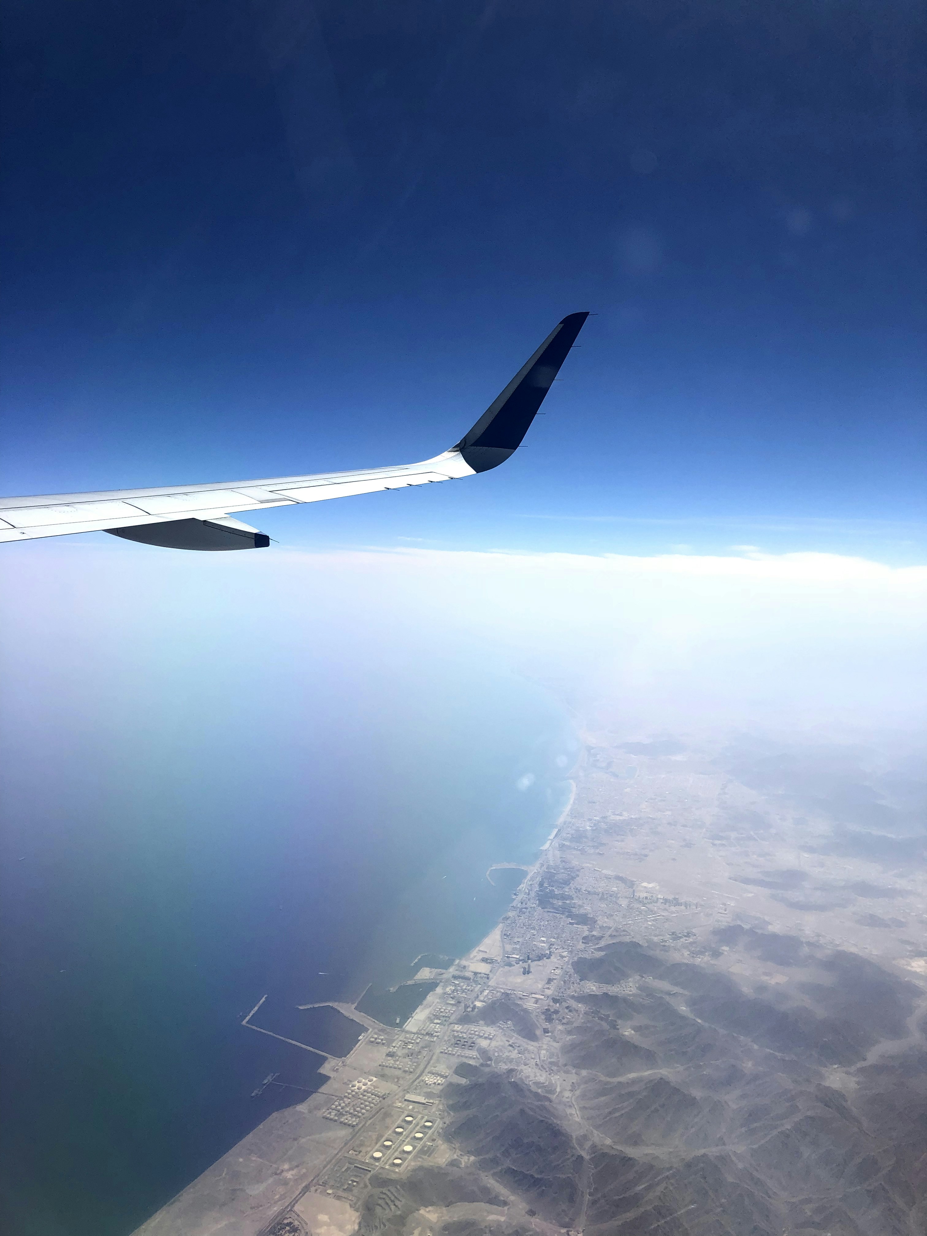 Scenic aerial view of a coastline with mountains and turquoise water