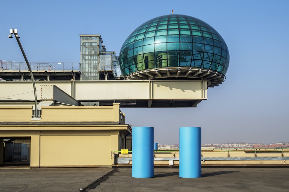 blue glass walled dome building