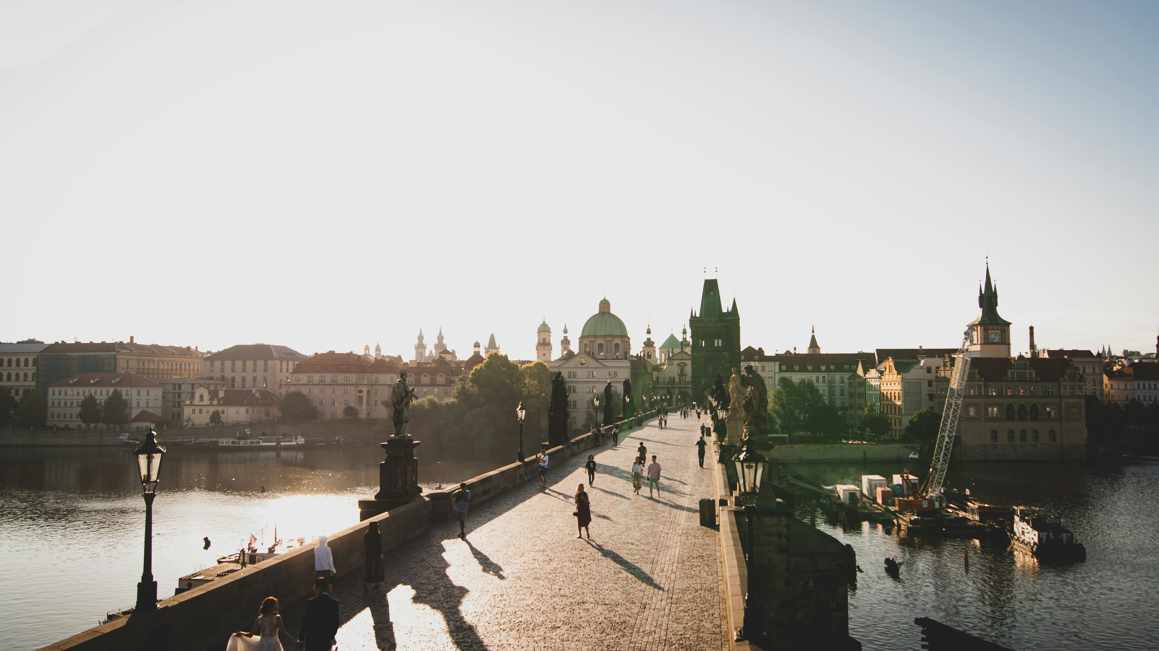 people walking on concrete bridge during daytime