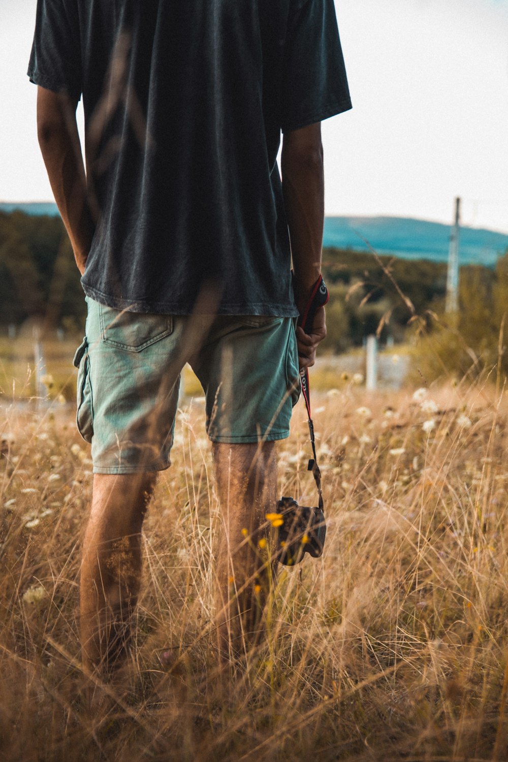 person wearing green shorts close-up photography