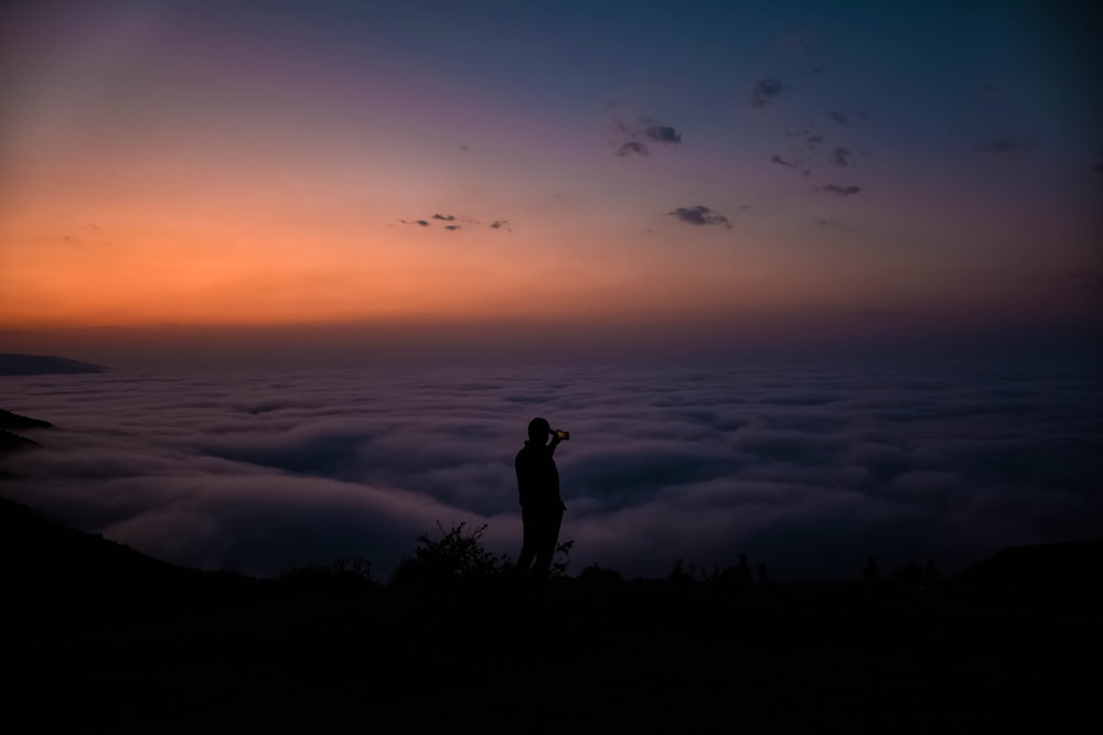 silhouette of standing person during golden hour