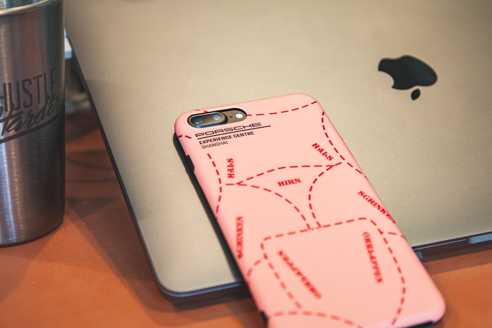 pink iPhone case close-up photography