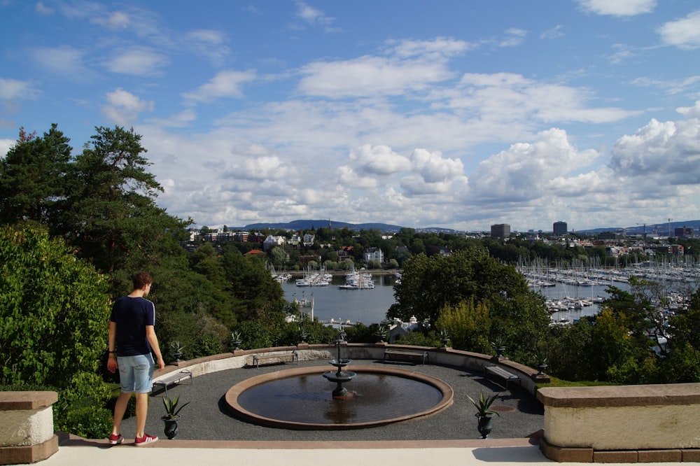 men near a fountain during daytime