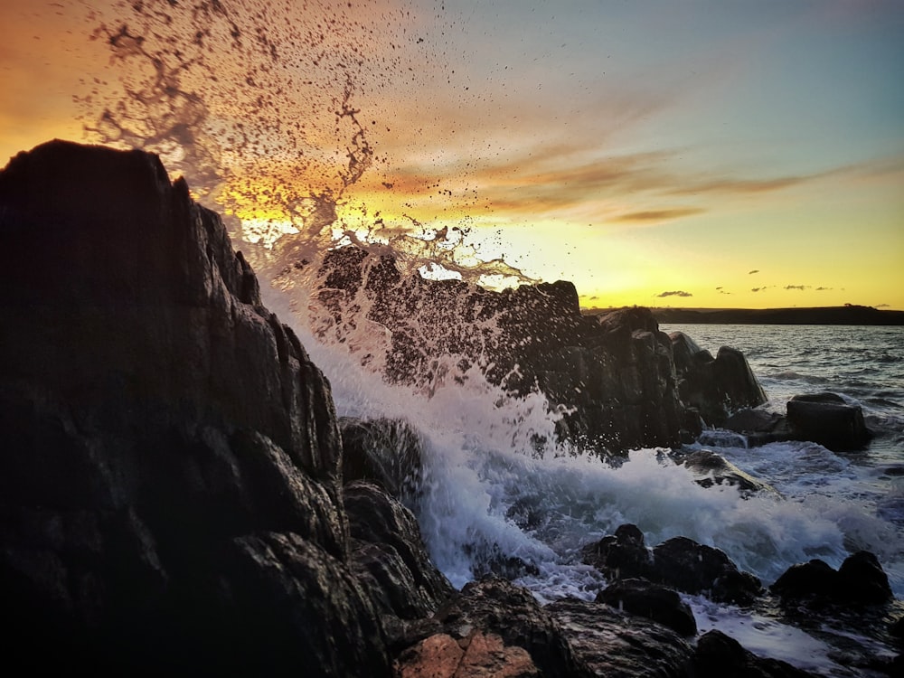 body of water near rocks