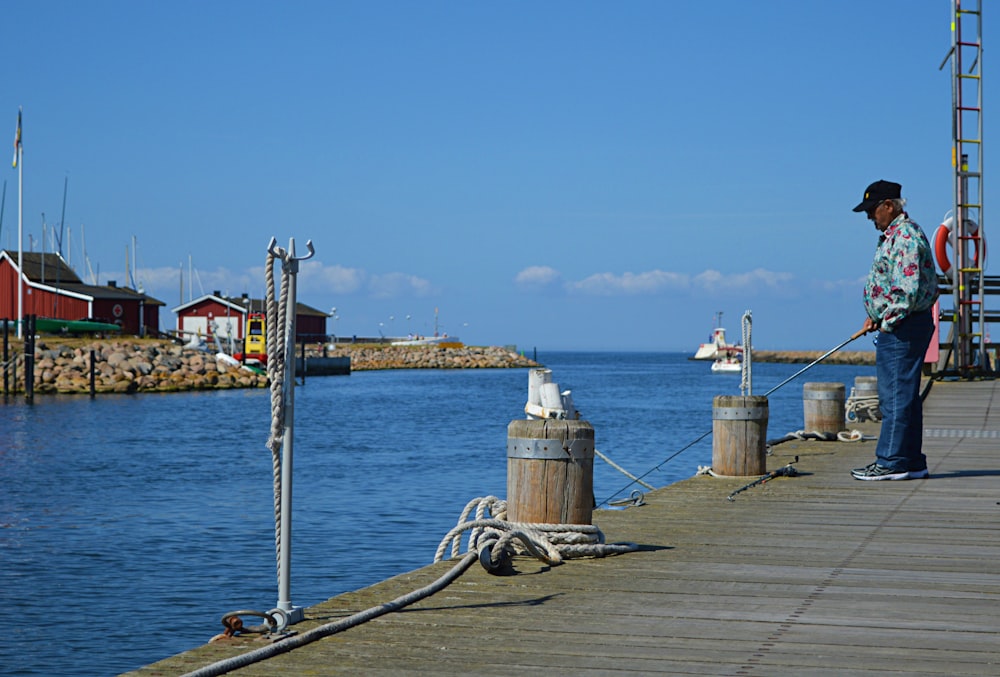 person standing on dockside