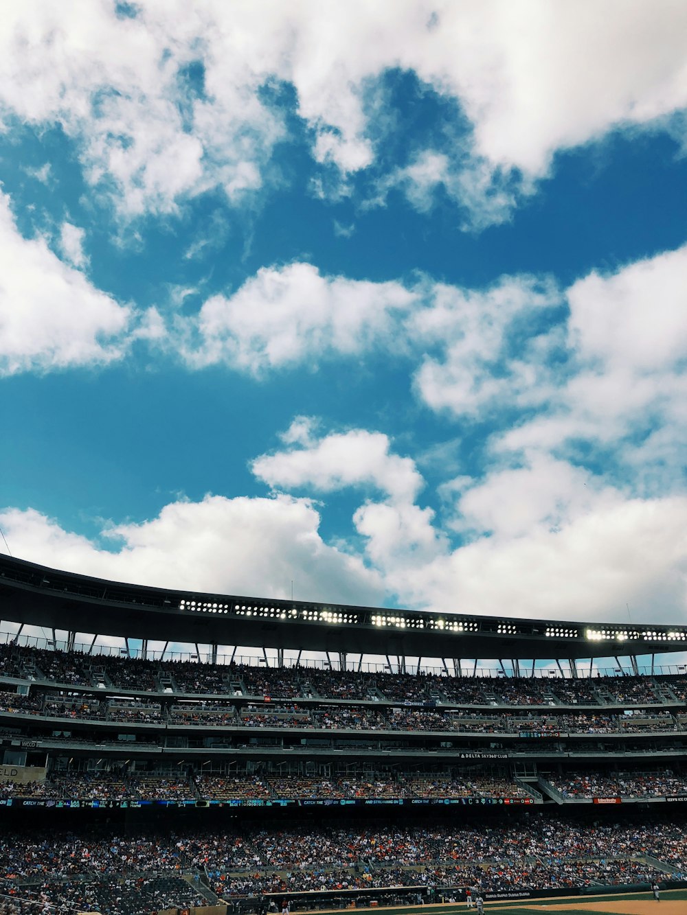 a baseball stadium filled with lots of people