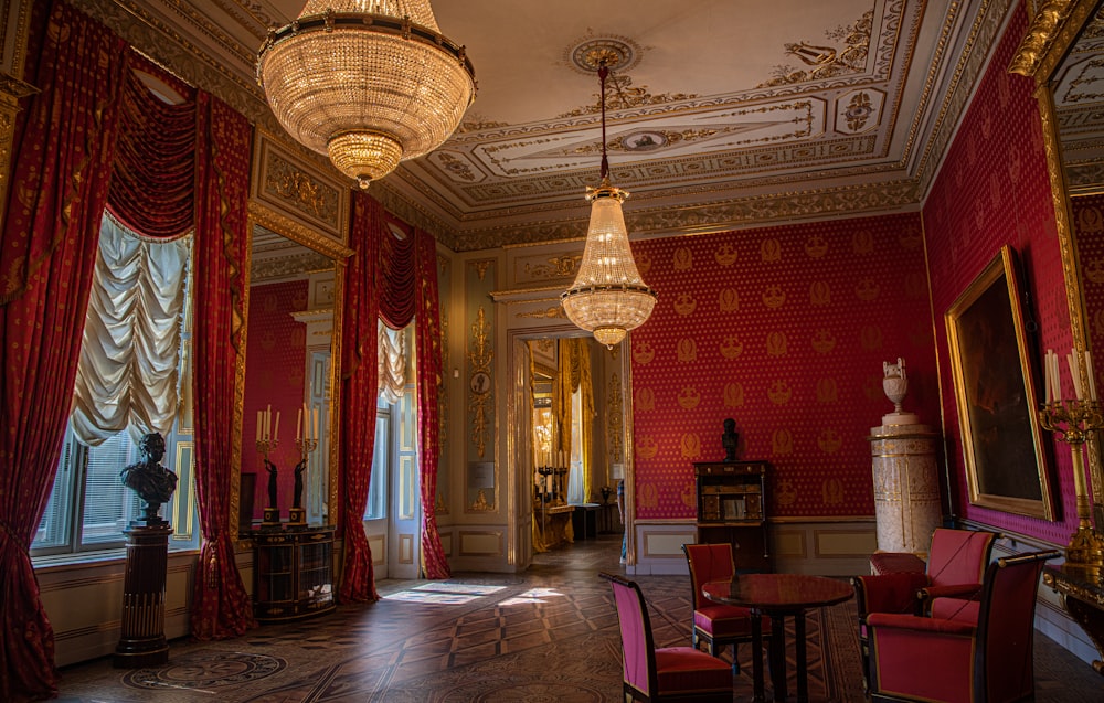 two brown-and-black glass beaded chandeliers inside white and red room