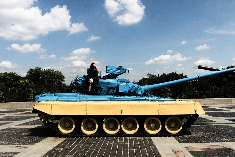 person sitting on tank