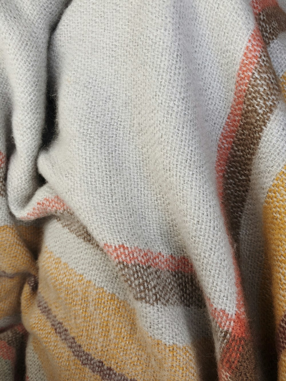 brown, yellow, and red knitted cloth