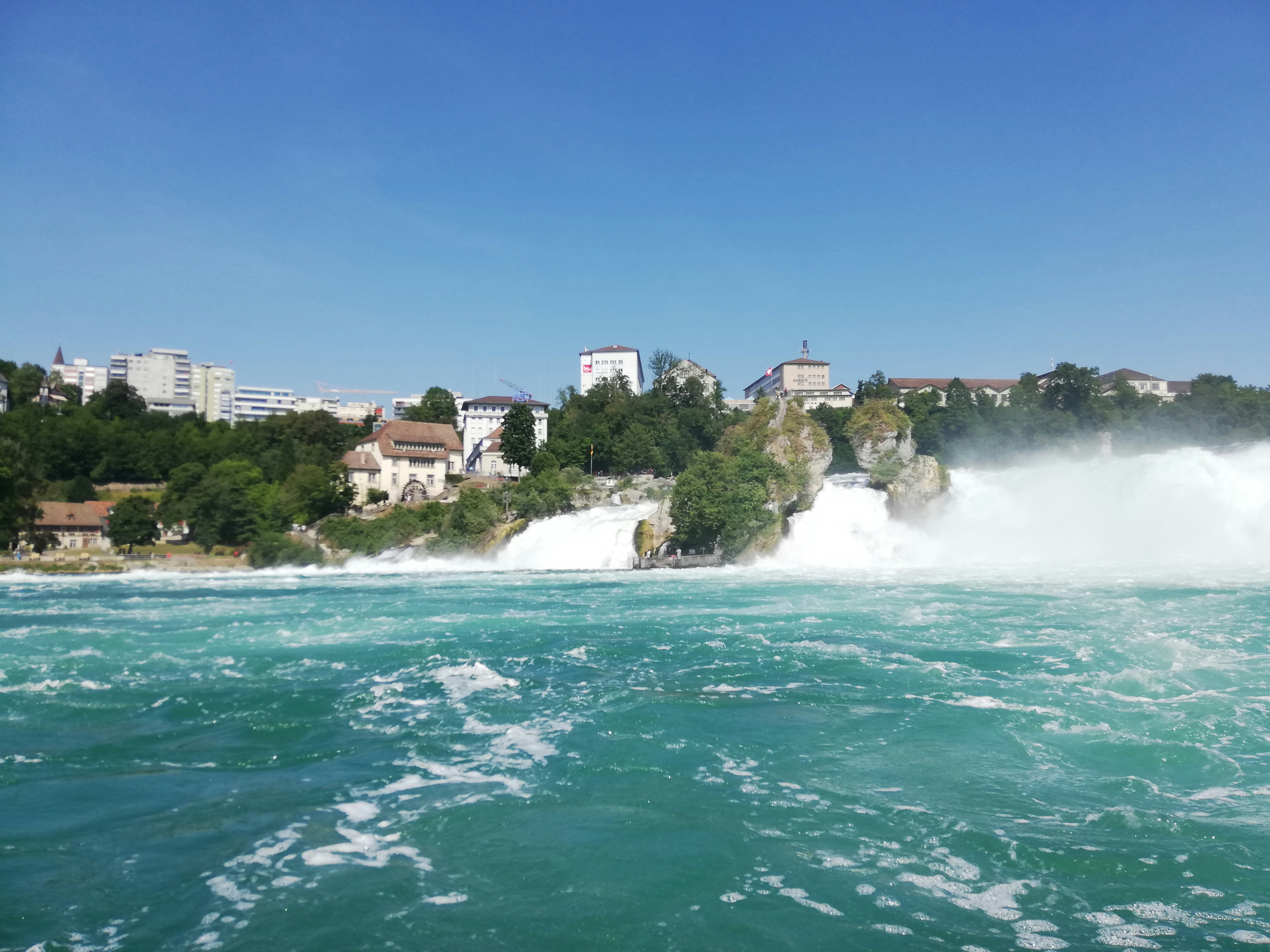 city buildings behind body of water
