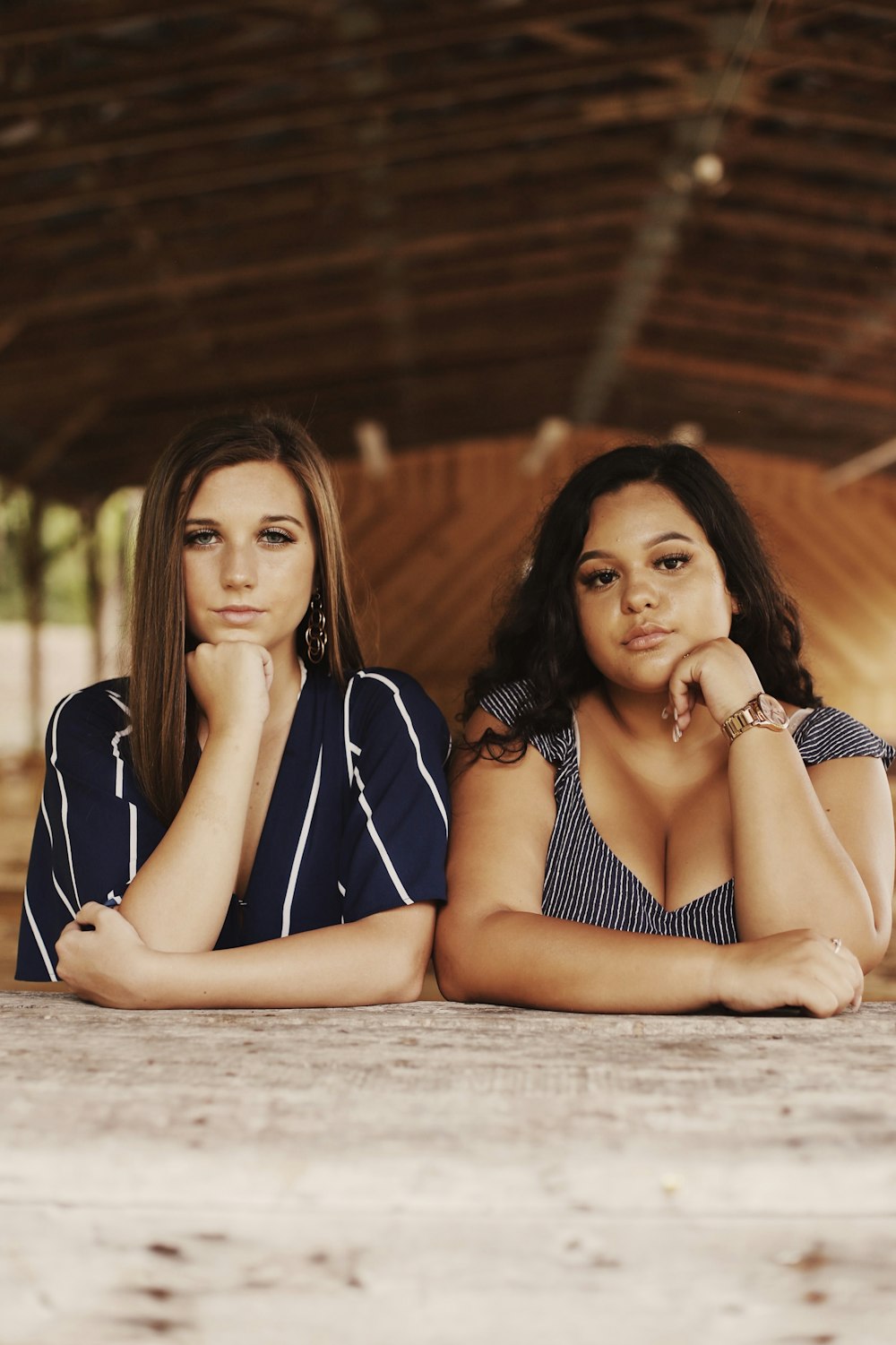 two woman sitting beside each other