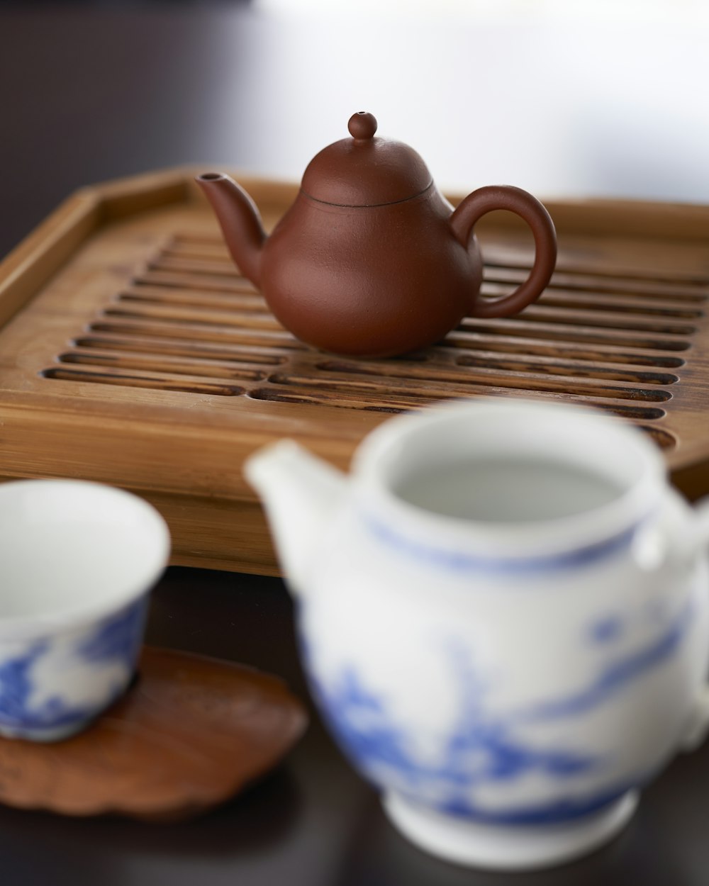 brown teapot on wooden tray