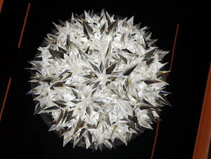 A glowing crystal cluster surrounded by golden stars and subtle moon symbols