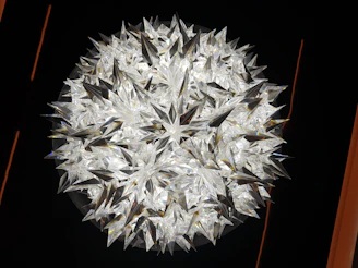 A glowing crystal cluster surrounded by golden stars and subtle moon symbols