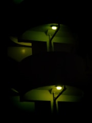 A sleek, modern architectural blueprint illuminated by soft emerald lighting.