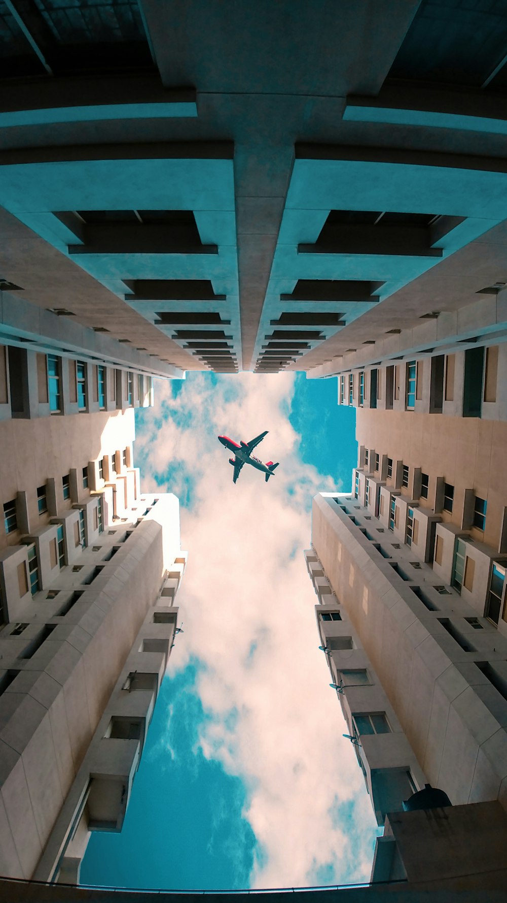 low angle photo of flying gray airliner