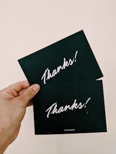 two black cards close-up photography