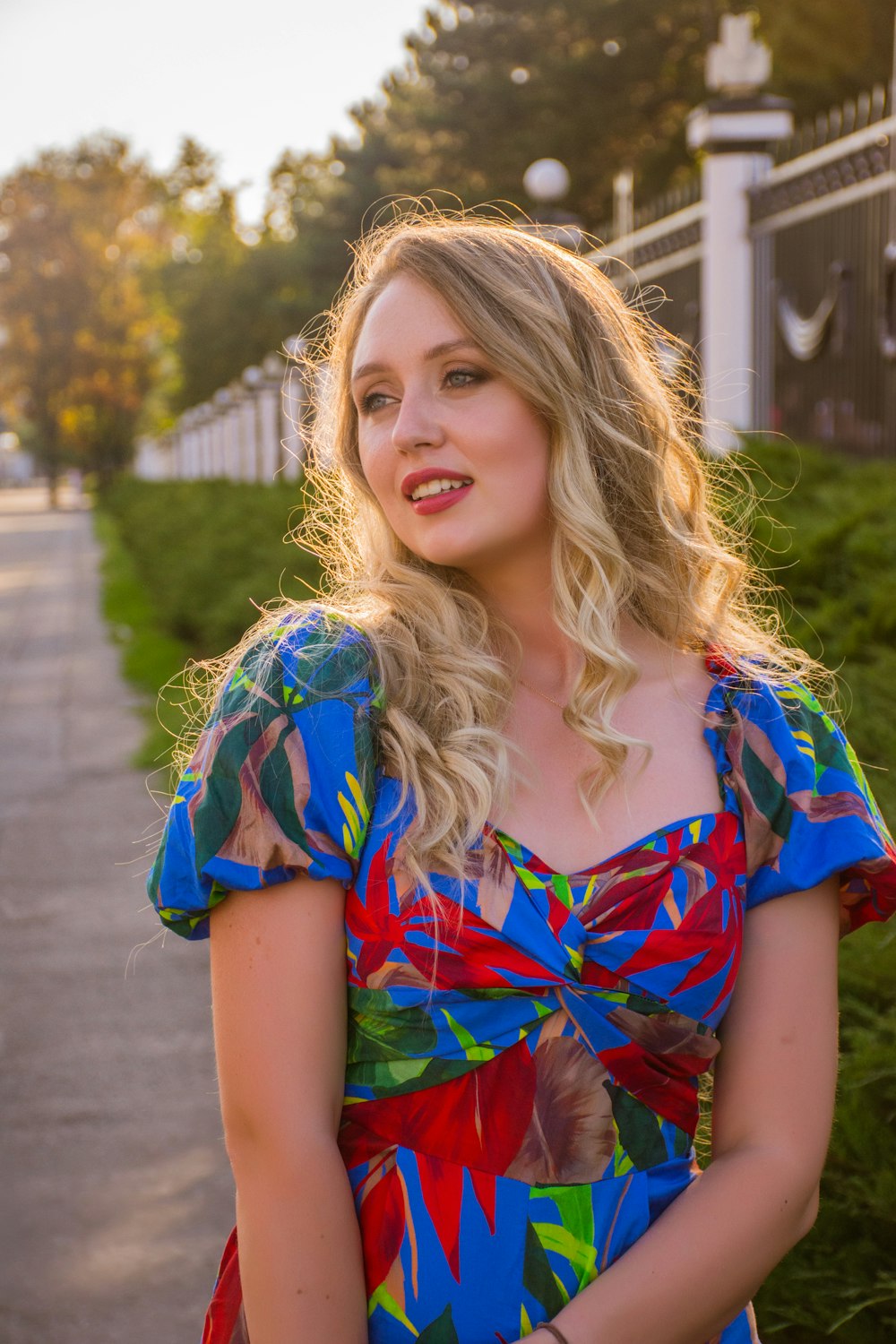 woman in red and blue dress on focus photography