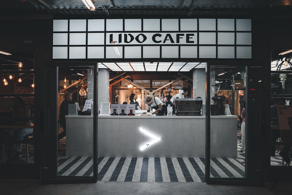 rectangular black and white Lido Cafe signage
