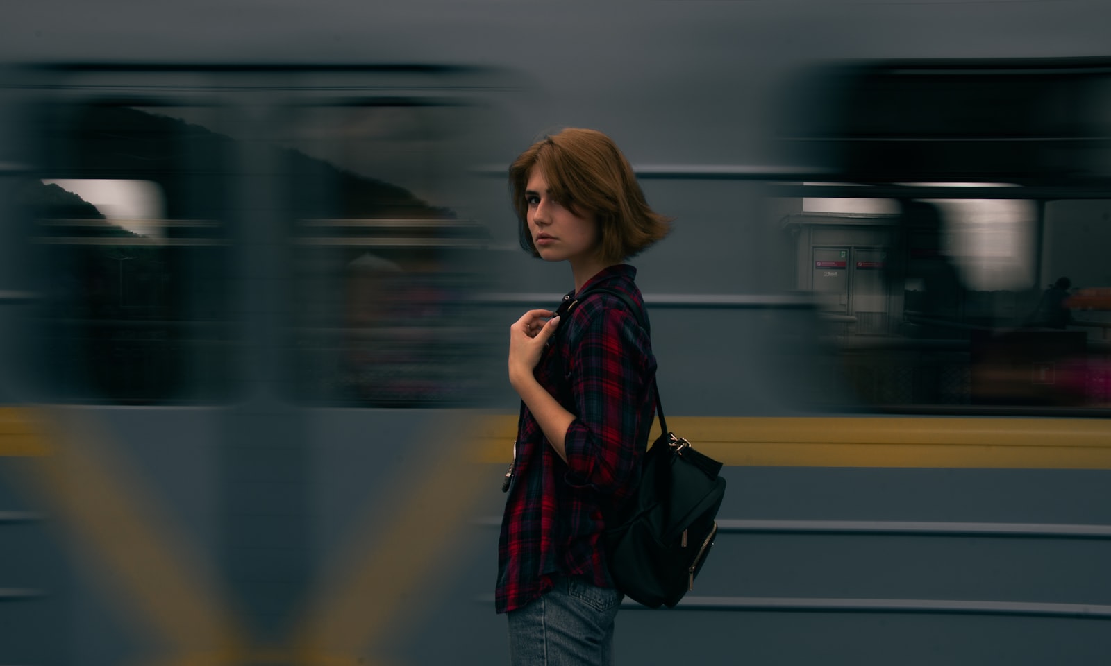 Sony DT 18-250mm F3.5-6.3 sample photo. Woman standing beside passing photography