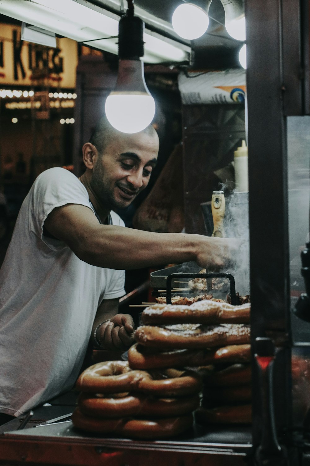 person cooking doughnut