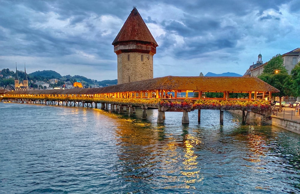 dock with roof and tower during day