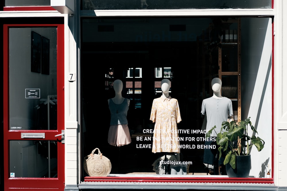 a store window with mannequins in it