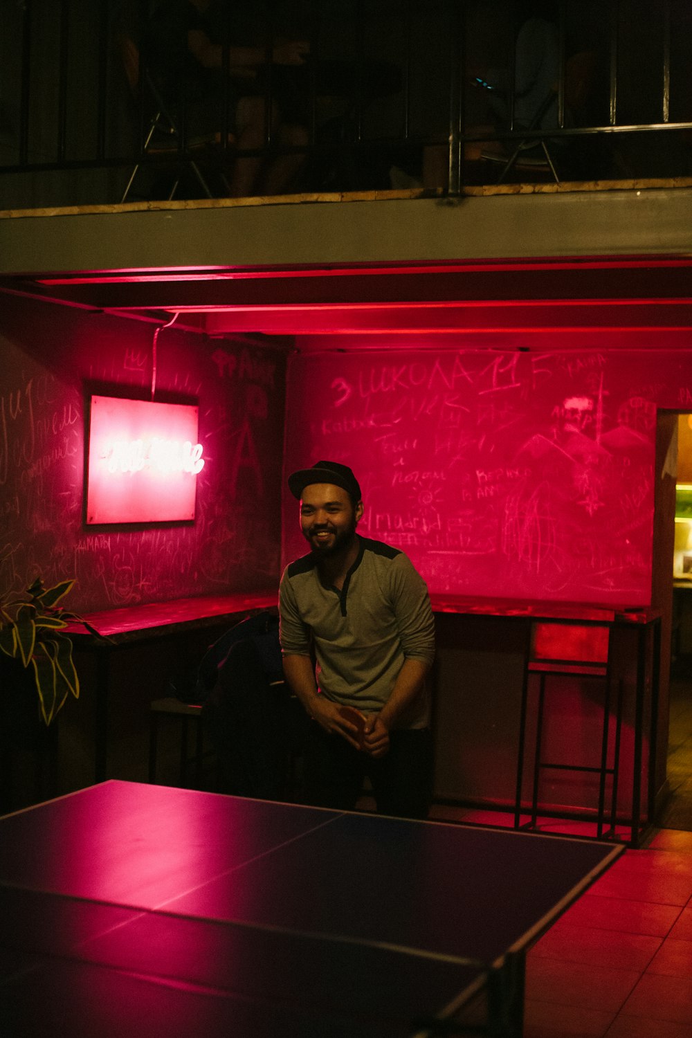 man standing near table tennis