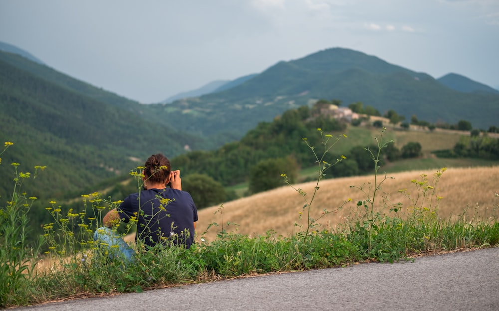 woman sitting on green grass