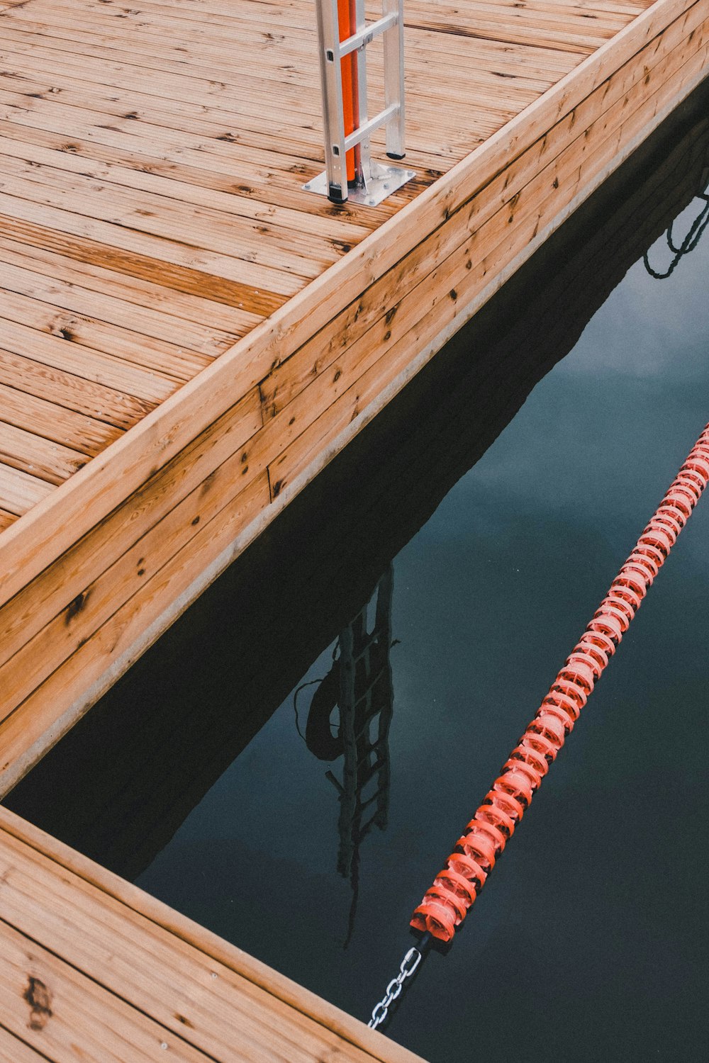 a wooden dock with a rope attached to it