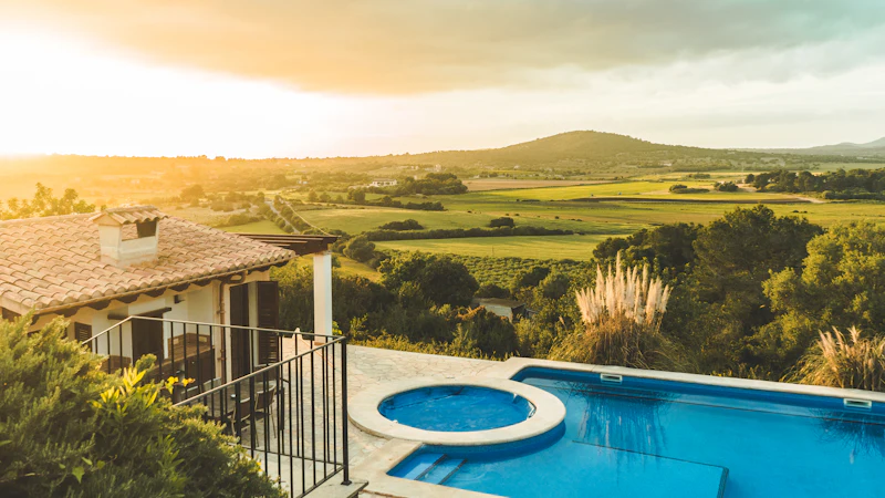 Pool overlooking green countryside