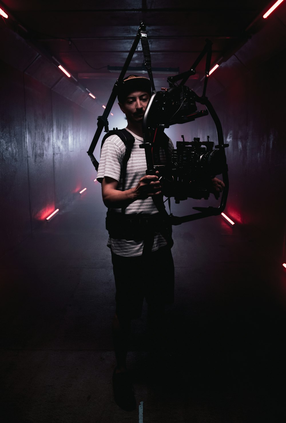 man holding black camera stabilizer