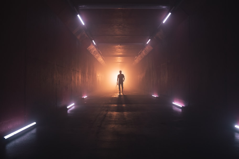 man standing in tunnel