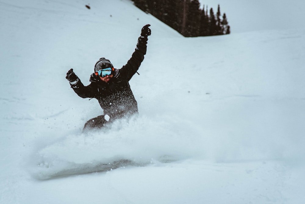 man skiing on snow