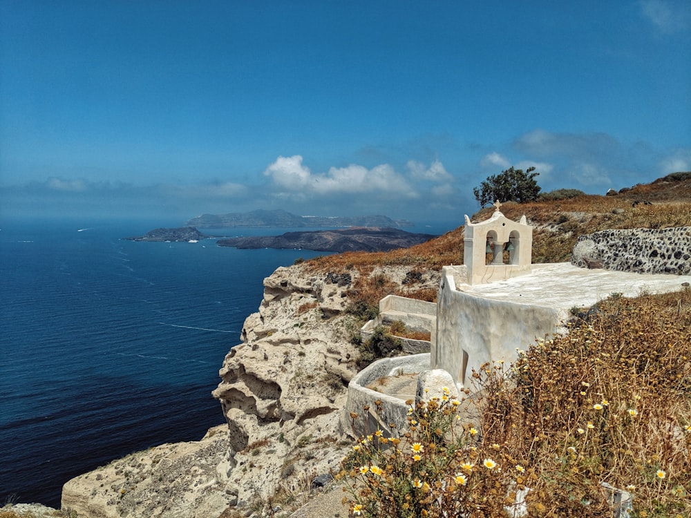 white cross monument on hill