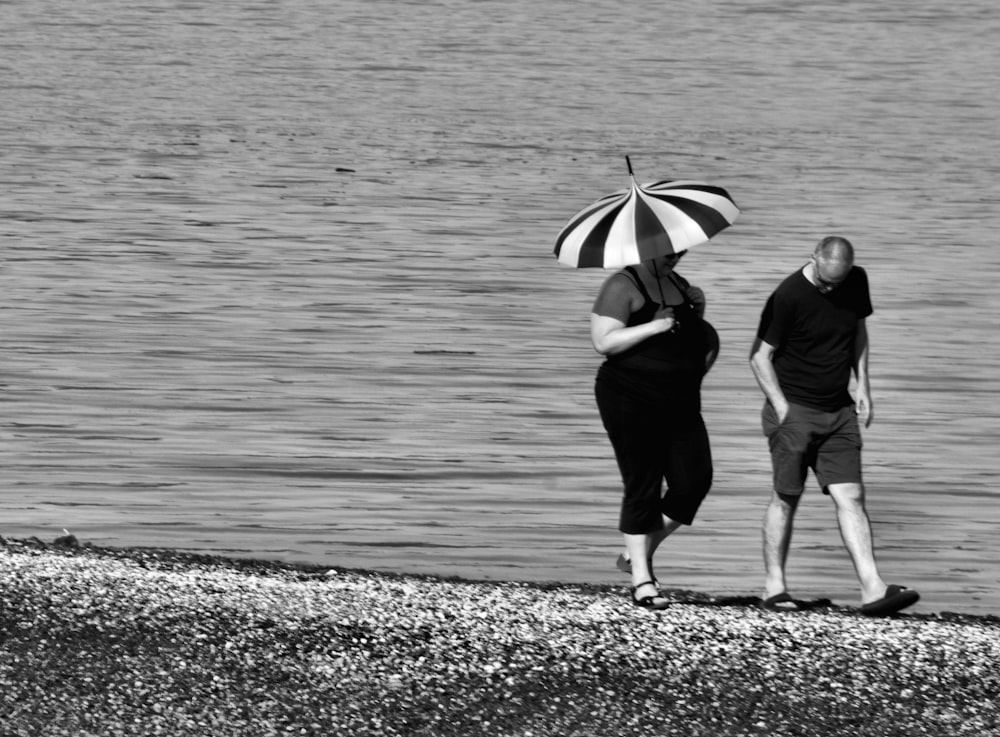 couple walking on seashore