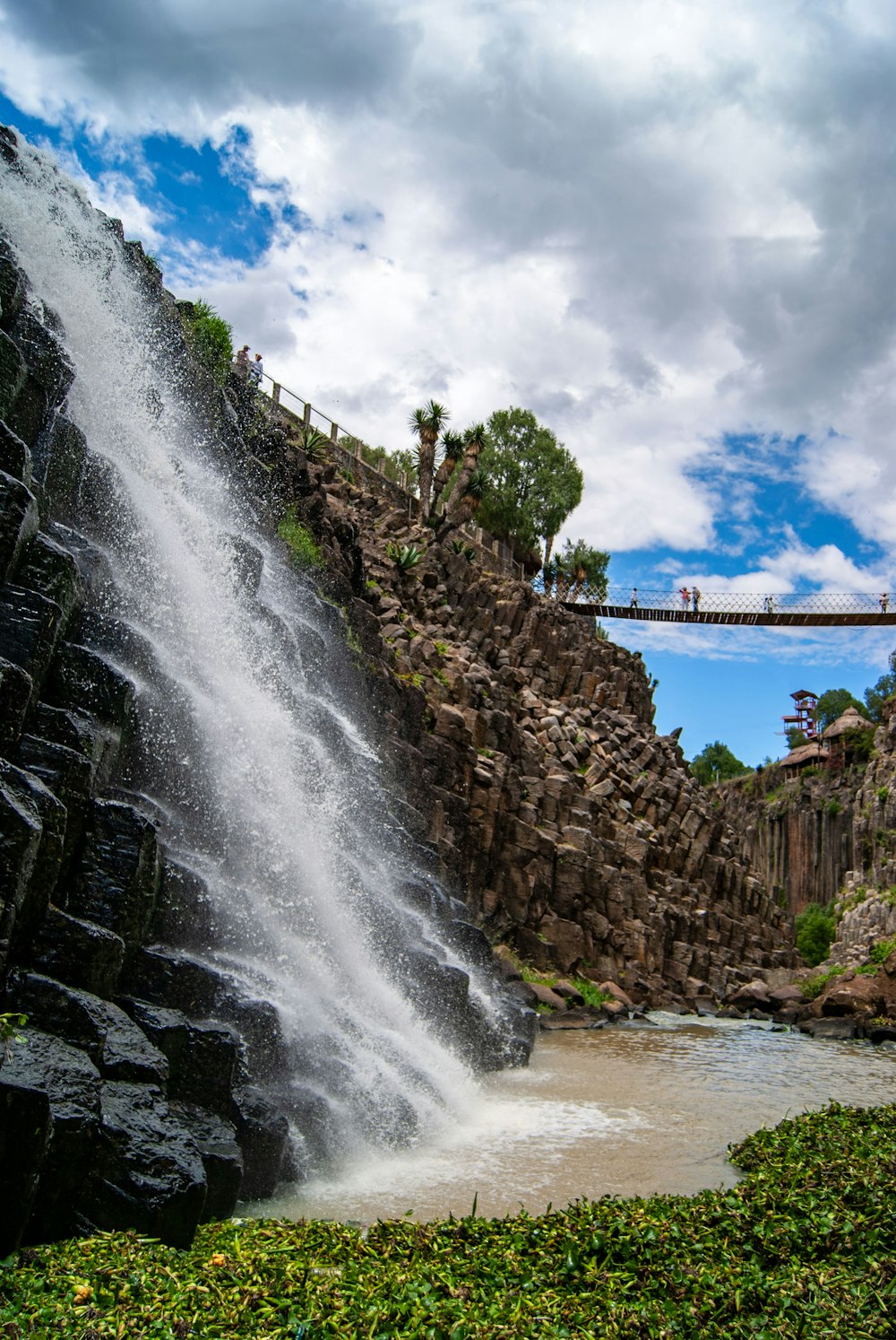 waterfalls near bridge